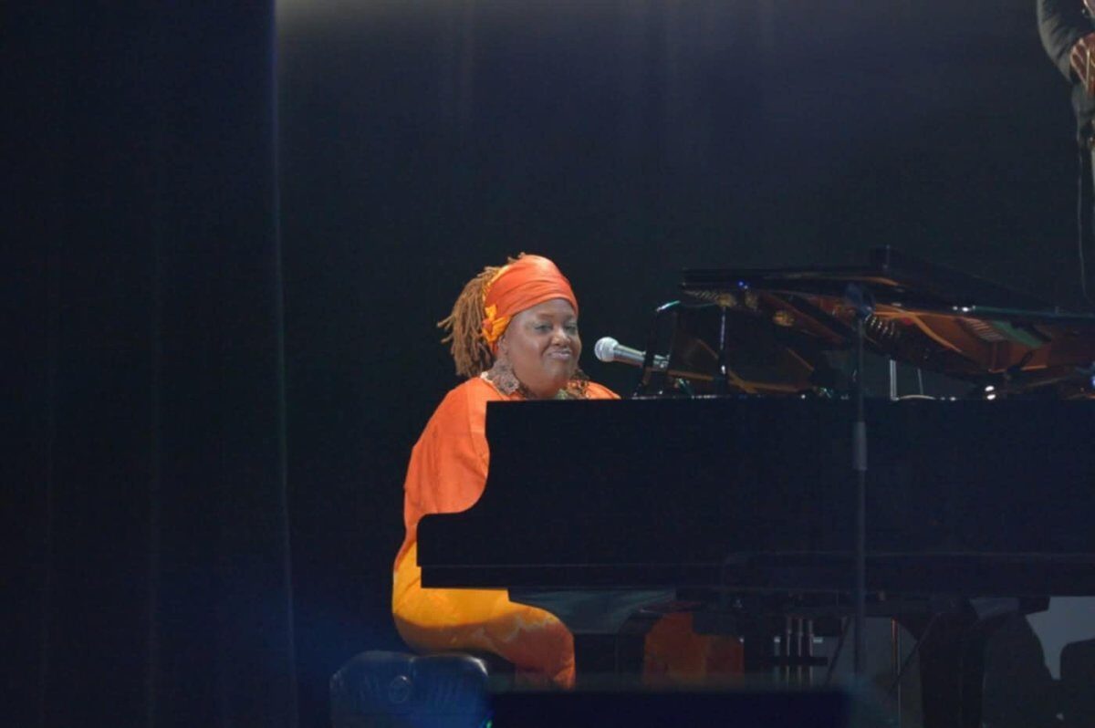 Female gospel singer is playing piano